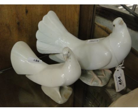 A Lladro dove and a smaller NAO dove.