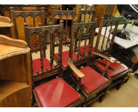 A set of 6 carved oak Ercol dining chairs (5+1).