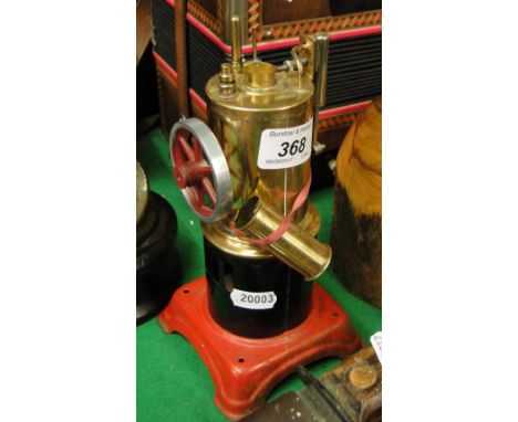 A brass vertical engine.