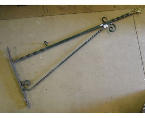 A large wrought-iron bracket for a pub sign.