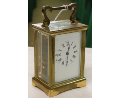 A brass cased carriage clock.