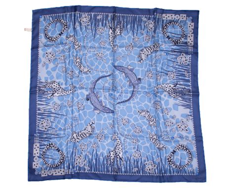 Cartier, a 100% silk Cartier Savann A Motif scarf with animal & gemstone print in a mixture of blues, measuring approx. 84cm 