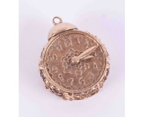 An ornate 9ct yellow gold clock charm/pendant? with six round cut garnets set to the sides, 8.29g, measures approx. 2cm x 2,5