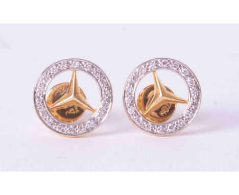 A pair of 18ct yellow &amp; white gold Mercedes Benz earrings set with an outer circle of small round brilliant cut diamonds,