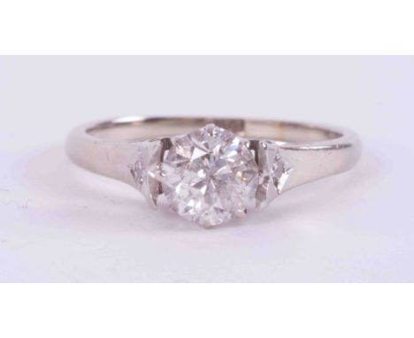 An 18ct white gold solitaire style ring set with approx. 0.75 carats of an older round brilliant cut diamond, colour H-I and 