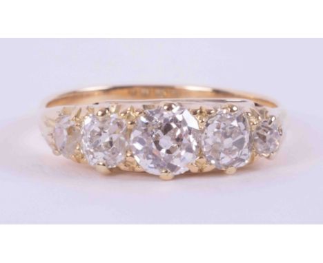 An 18ct yellow gold (no hallmarks) Edwardian ring set with five old round cut diamonds, approx. total diamond weight just ove