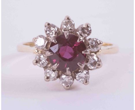 An 18ct yellow gold cluster ring set with approx. 1.00 carat of round cut ruby surrounded by approx. 0.40 carats of round bri