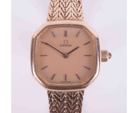 Omega, a ladies vintage 9ct yellow gold Quartz wristwatch with hexagonal shaped face, herringbone design bracelet with ladder