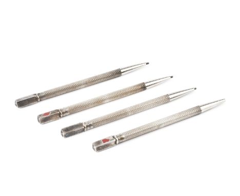A set of four silver bridge pencils, with engine turned decoration and decorated with card suits (worn), stamped sterling, 9c