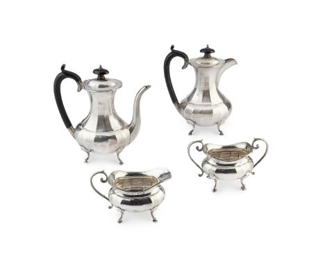 A George V silver four piece bachelor's tea service, of faceted baluster form, the teapot and hot water pot with ebonised han