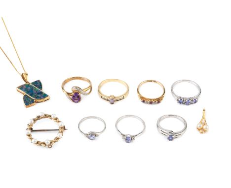 A collection of jewellery, comprising seven assorted gem set and stone set dress rings, a composite opal doublet pendant on c