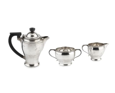 A George VI silver three piece tea service, with ropetwist borders, the teapot with ebonised handle and knop, by William Neal