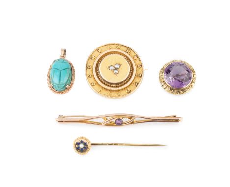 A late Victorian half pearl panel brooch, the circular panel centred with a trefoil of half pearls, bordered by flowerheads, 