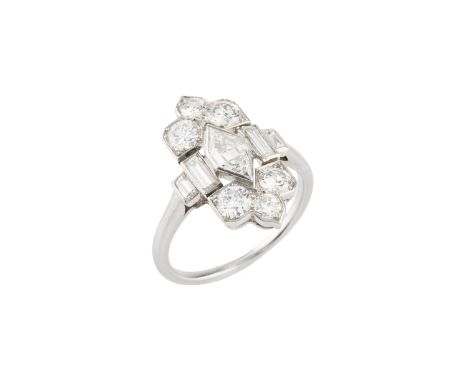 An Art Deco diamond panel ring possibly by Cartier, the shaped rectangular panel centred with a lozenge-shaped step-cut diamo