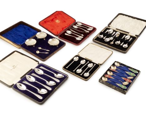 A collection of silver flatware, comprising a set of six grapefruit spoons by Walker &amp; Hall, Sheffield 1928, another set 