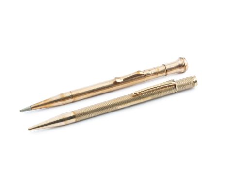A 9ct gold propelling pencil, with engine turned decoration, stamped 9 375, 12cm long, and a similar gold plated pencil. (2)g