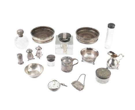 A collection of silver, to include a late Victorian cream jug and sugar basin, Birmingham 1898, a pair of peppers, a decanter