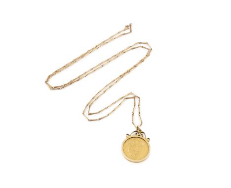 A George III spade guinea, loose mounted in a 9ct gold scrolled pendant frame, suspended from a fancy baton-link chain, penda