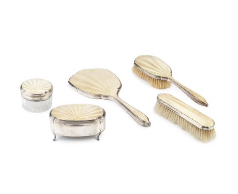 A George V silver and yellow guilloche enamel dressing table set, comprising shaped oval trinket box with hinged cover, 11.5c