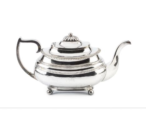 A George IV silver teapot, of rounded rectangular form with gadrooned border, the shaped handle with ivory insulators, on bal