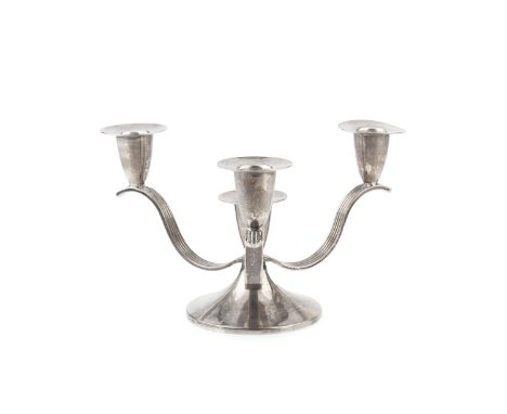 A silver four light candlestick, having three reeded strap branches issuing from a circular spreading foot, by Mappin &amp; W