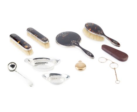 A silver mounted tortoiseshell dressing table set, with piqué inset decoration comprising hand mirror, hair brush and two clo