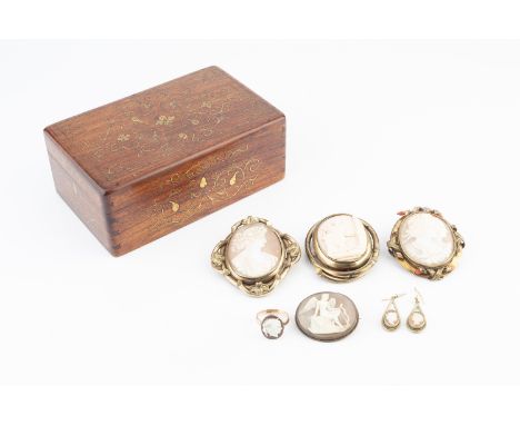 A collection of 19th century and later cameo jewellery, comprising an oval shell cameo brooch, the scroll decorated mount wit