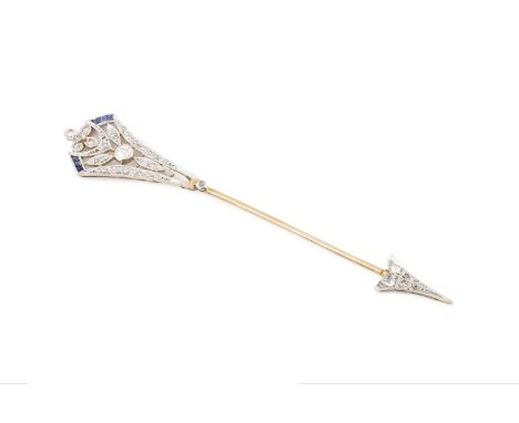 A diamond and gem set jabot pin, designed as an arrow, the pierced and millegrained flight set with old and lasque-cut diamon