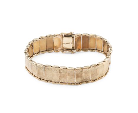 A 9ct gold fancy-link strap bracelet, with engine-turned decoration, stamped '9CT', length 18cmGross weight only approximatel