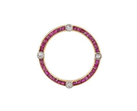 A ruby and diamond circlet brooch, millegrain set with four round brilliant-cut diamonds, spaced by channels of step-cut rubi