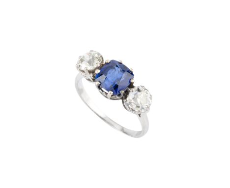 A sapphire and diamond three stone ring, the cushion-shaped mixed-cut sapphire claw set between two old brilliant-cut diamond