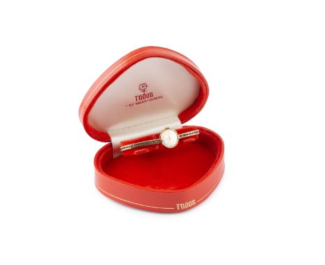 A lady's 9ct gold 'Royal' bracelet watch by Tudor, the circular signed silvered dial with gilt baton and arrowhead markers, t