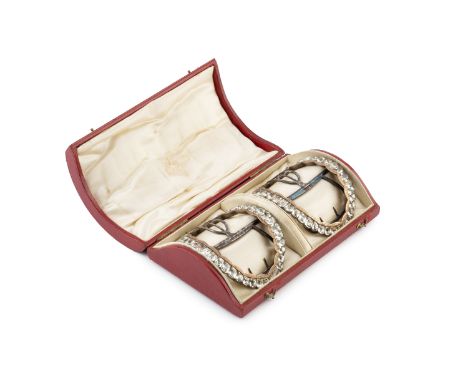 A pair of George III paste set shoe buckles, of graduated oval form with engraved gilt inner borders, and steel fittings with