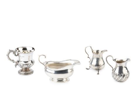An early Victorian silver christening mug, the thistle shaped body embossed and chased with alternating stiff leaves and flow