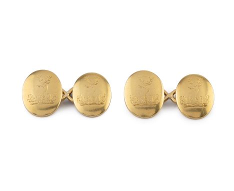 A pair of cufflinks, the oval panels engraved with stag's head crests, on figure-of-eight fittings, stamped '18', panel lengt