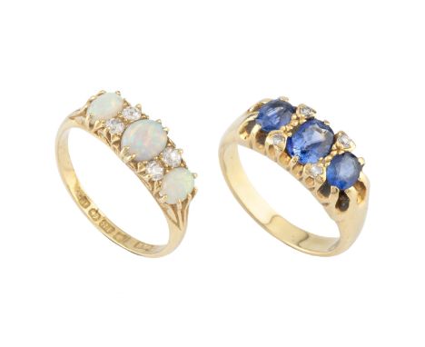 A sapphire and diamond half hoop ring, the trio of graduated oval mixed-cut sapphires spaced by round brilliant-cut diamond p