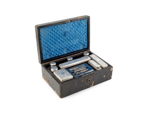 An early Victorian toilet box, with leather covered exterior, the fitted interior containing a range of silver topped glass s