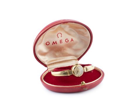 A 'Ladymatic' automatic bracelet watch by Omega, the circular textured gilt dial with faceted baton markers, to a calibre 455