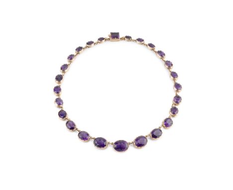 A 19th century amethyst rivière necklace, designed as a line of graduated oval mixed-cut amethysts in open-backed pinched col