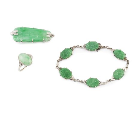 A collection of jade jewellery, comprising a dress ring, the oval cabochon jadeite in millegrain collet setting, between sing
