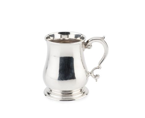 A George II silver mug, of baluster form with scroll handle, by Thomas Whipham, London 1743, engraved initials B*L to T*L to 