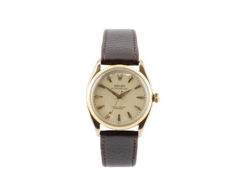 An 'Oyster Perpetual' wristwatch by Rolex, circa 1955, the circular textured dial with gilt faceted baton markers, tapered lu