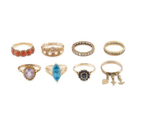 A collection of dress rings, comprising a cabochon coral half hoop ring, with floral carved shoulders, a diamond and cultured