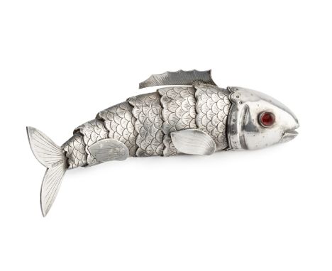 A Chinese export silver articulated fish, with cabochon red glass inset eyes, hinged mouth and fins, and scale engraved body,