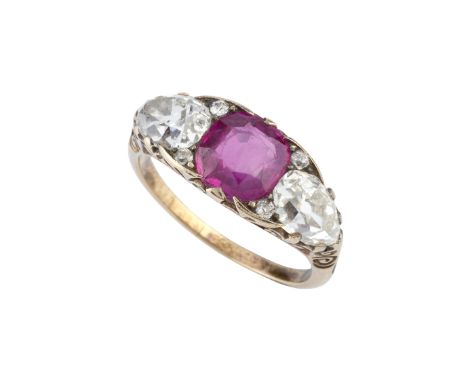 A ruby and diamond three stone ring, the cushion-shaped mixed-cut ruby framed by two pear-shaped old-cut diamonds, spaced by 