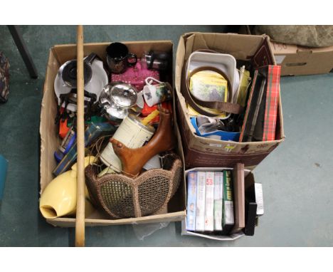 Three boxes of kitchenware, light shade, videos, tins, walking stick etc