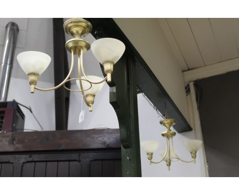 Pair of three branch ceiling light fittings with shades 