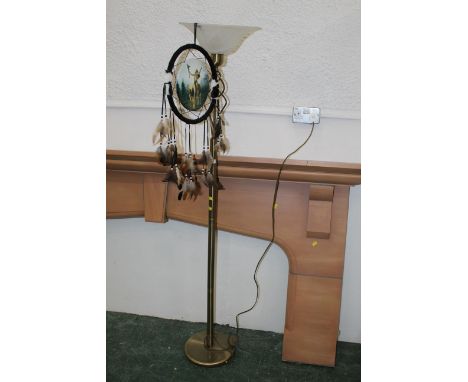 Modern chrome up-lighter with glass shade with Indian feather decoration