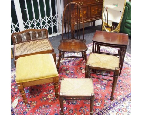 An unusual low back stool, canework back and seat, cabriole forelegs, pad feet; an oak side chair; a nest of three occasional