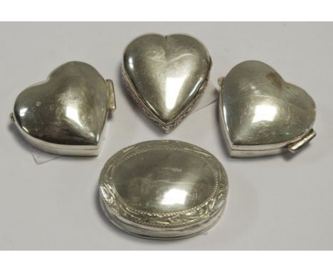 Three sterling silver trinket pots in the form of love hearts; another oval (4) 